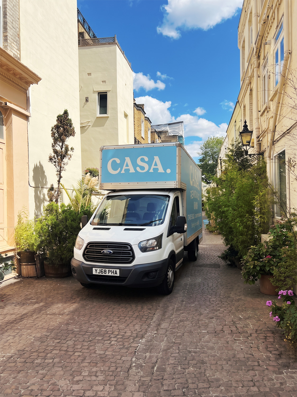 Bluebell, the powder blue CASA. Luton van, parked in a leafy London mews