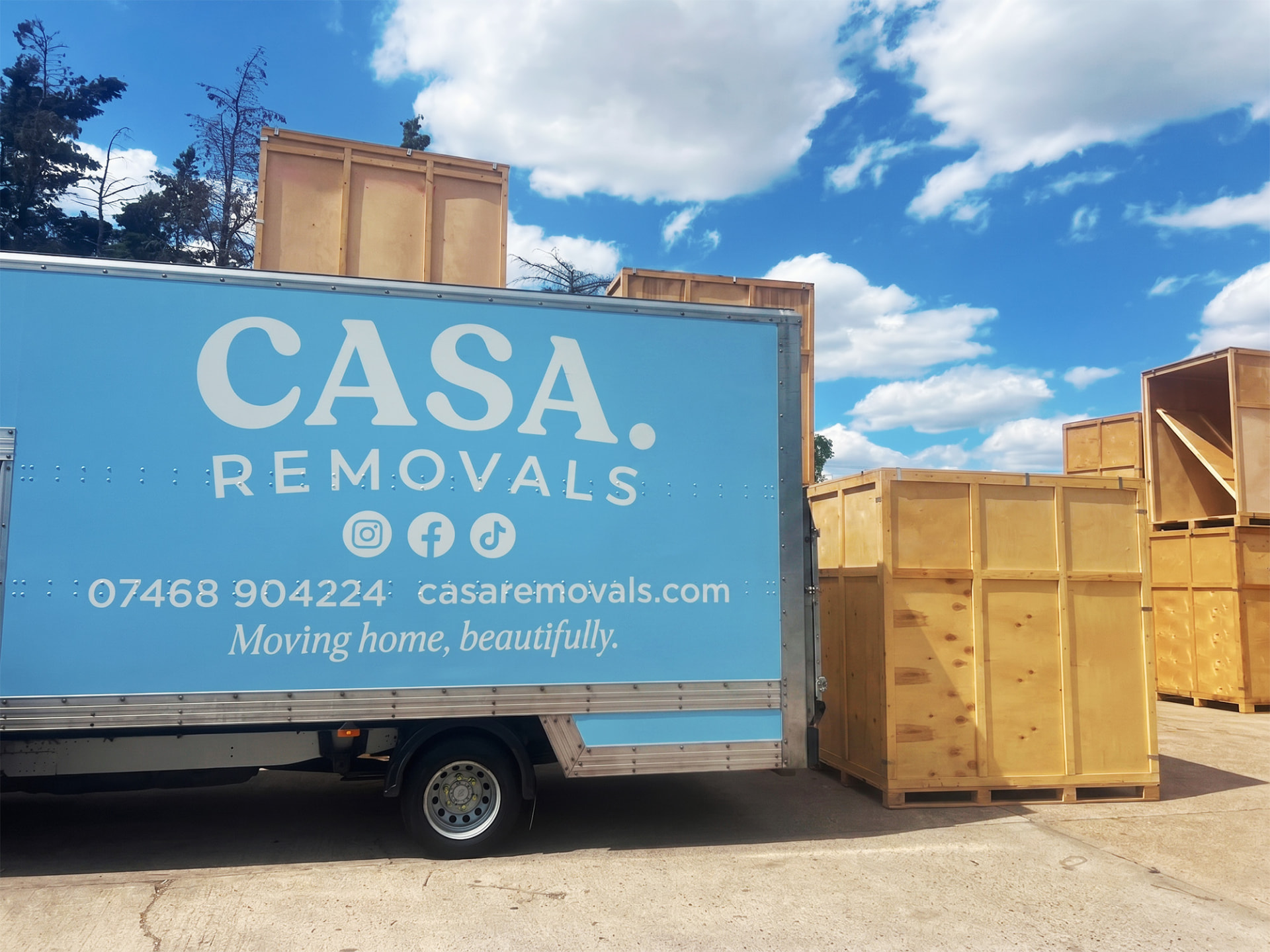 A CASA. van beside timber storage containers at the CASA. storage yard